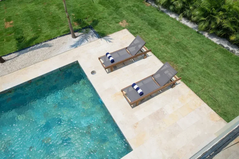 Overhead view of Casa de Acero's pool, travertine deck and lawn.