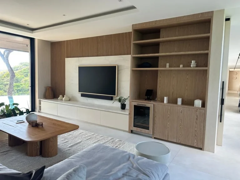 Custom oak media wall with shelving and wine fridge, Escazú renovation