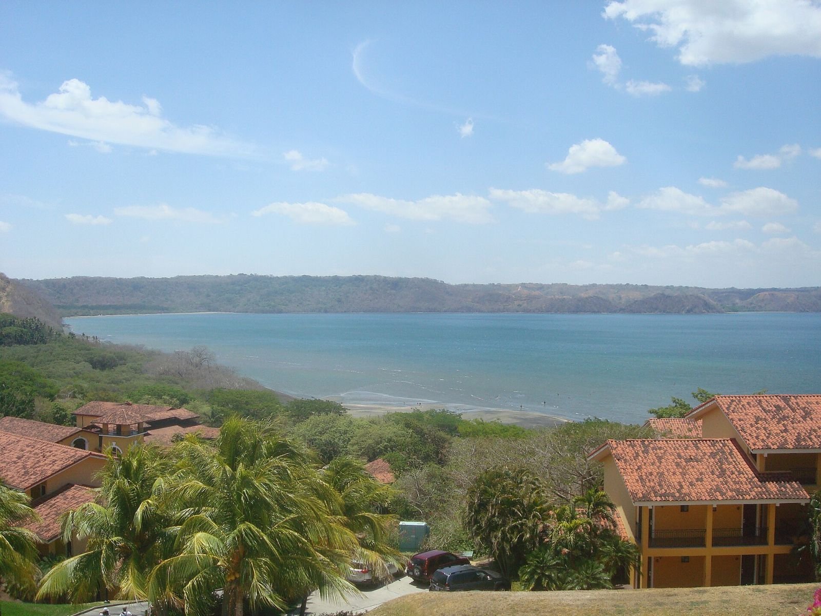 View across the Gulf of Papagayo in Guanacaste, Costa Rica, with rooftops in the foreground.