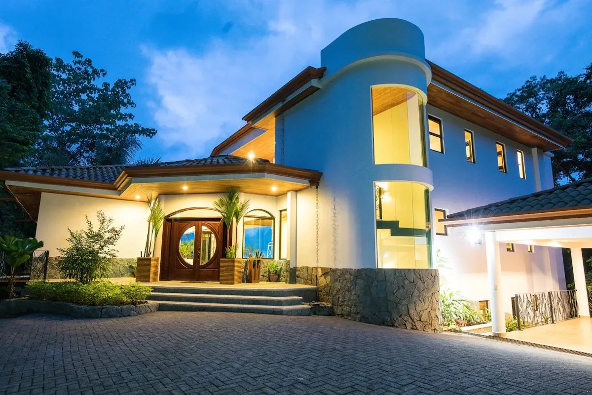 Entrance of the rainforest ocean-view villa we built in Manuel Antonio, at dusk