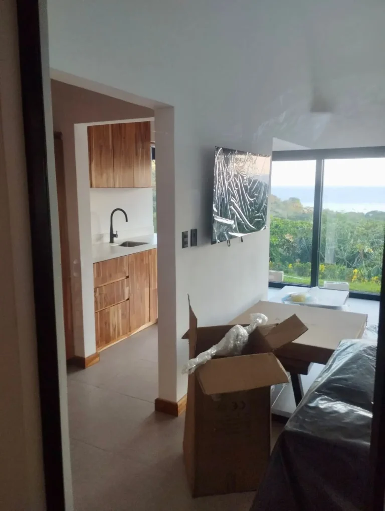 Walk-in shower with a picture window to the ocean